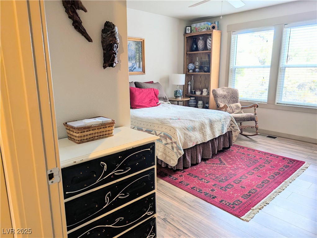 8320 Mother Lode Road Pioche, NV 89043 - Photo 35 of 46 Bedroom #2 with light wood flooring and a ceiling fan