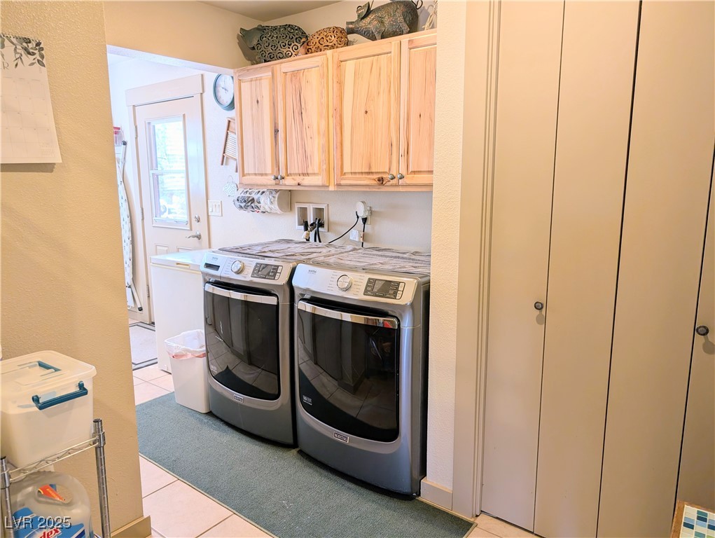 8320 Mother Lode Road Pioche, NV 89043 - Photo 38 of 46 Laundry area featuring ceramic tile floors, cabinet space, washer and dryer, and room for freezers