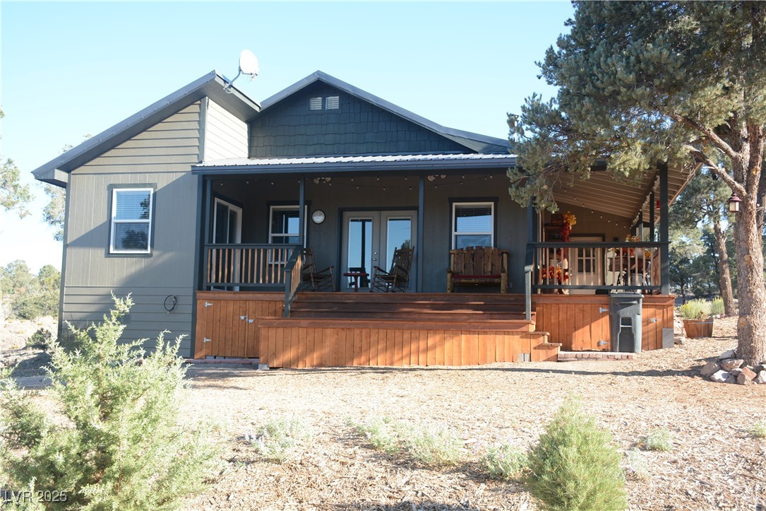 8320 Mother Lode Road Pioche, NV 89043 - Photo 6 of 46 Side view of house featuring covered porch