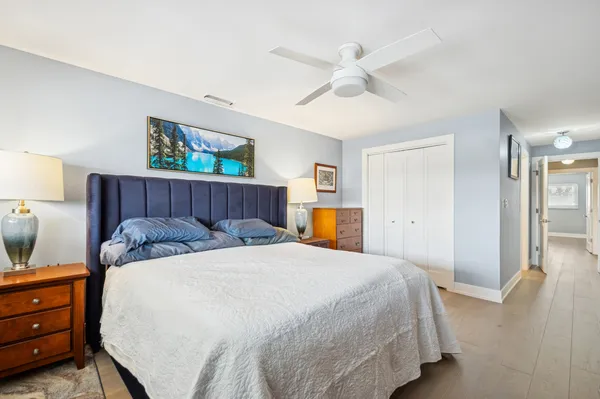 a bedroom with a bed and a dresser