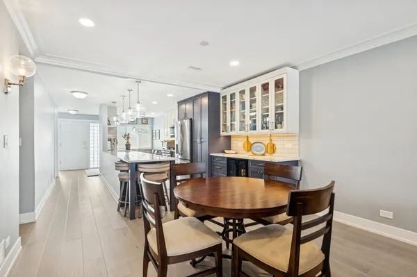 a dining room with furniture and window