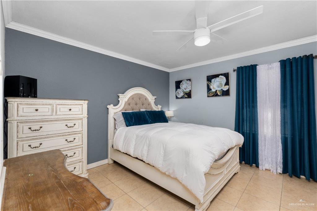 118 J R Becerra Avenue Progreso, TX 78596 - Photo 8 of 17 a bedroom with a bed and a window