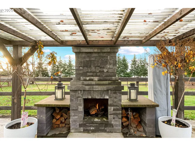 a view of a porch with furniture and a fireplace