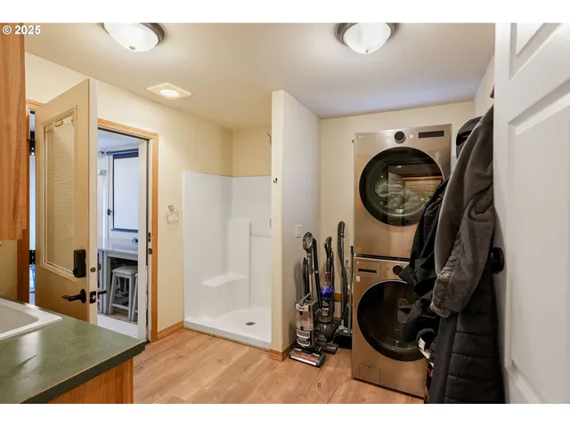 a view of a hallway with washer and dryer
