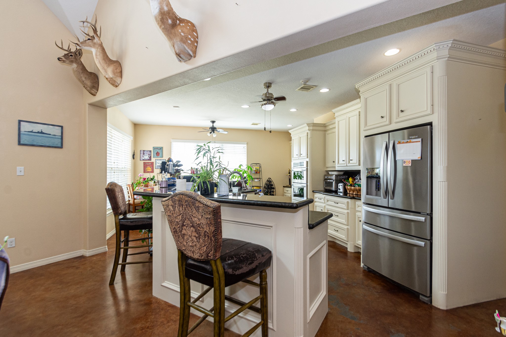 5 Shore Acres Circle Shoreacres, TX 77571 - Photo 12 of 38 a kitchen with stainless steel appliances granite countertop a table chairs stove and cabinets