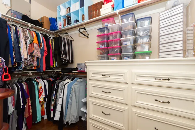 a bathroom with a granite countertop sink a toilet and a mirror