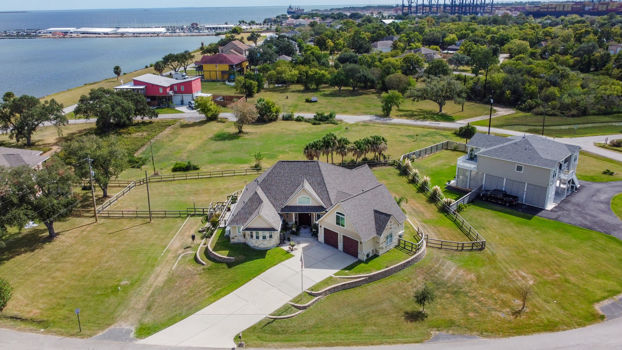 5 Shore Acres Circle Shoreacres, TX 77571 - Photo 3 of 38 an aerial view of a house with swimming pool and ocean view