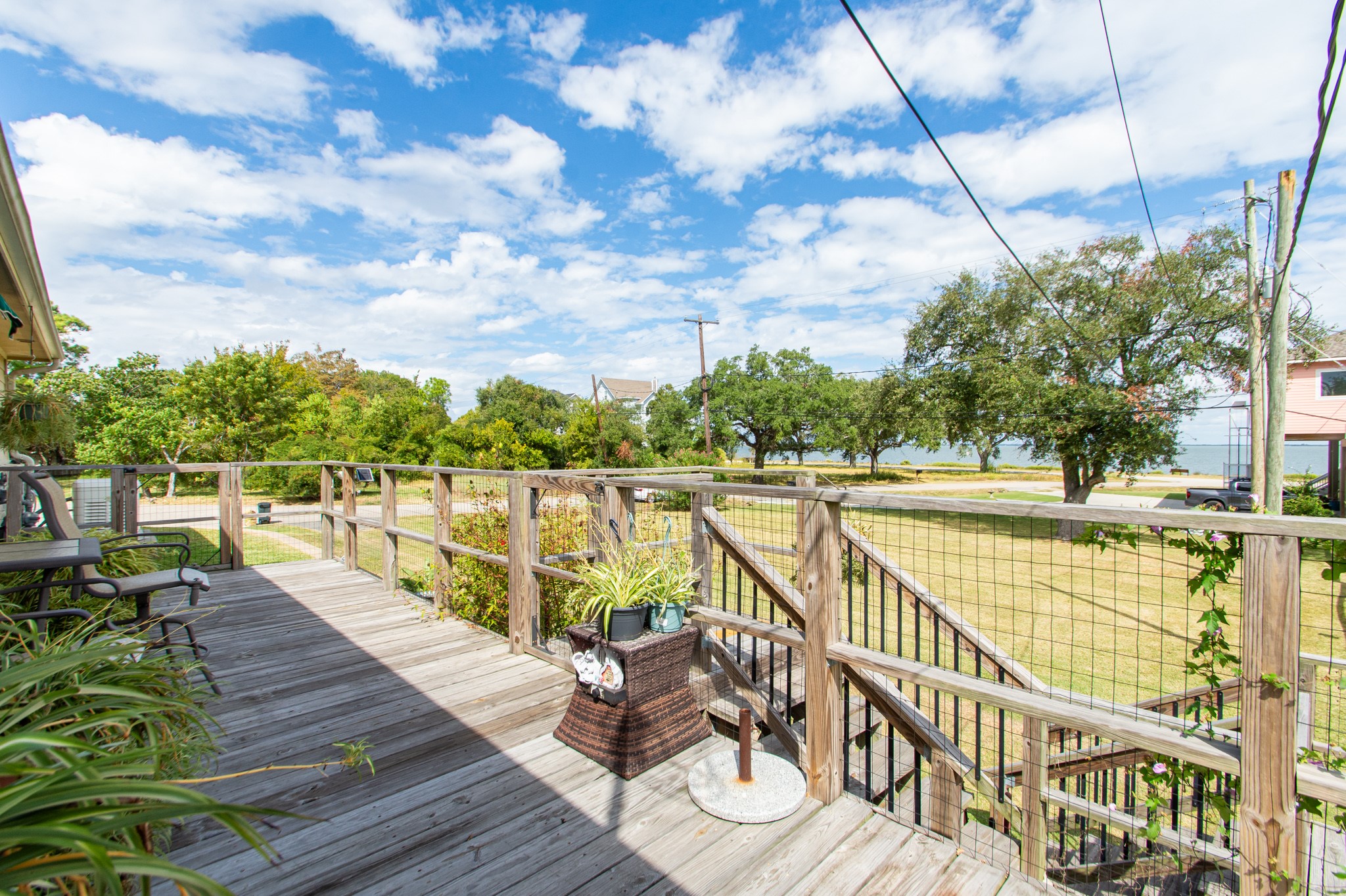 5 Shore Acres Circle Shoreacres, TX 77571 - Photo 31 of 38 a view of a balcony with wooden floor and iron fence