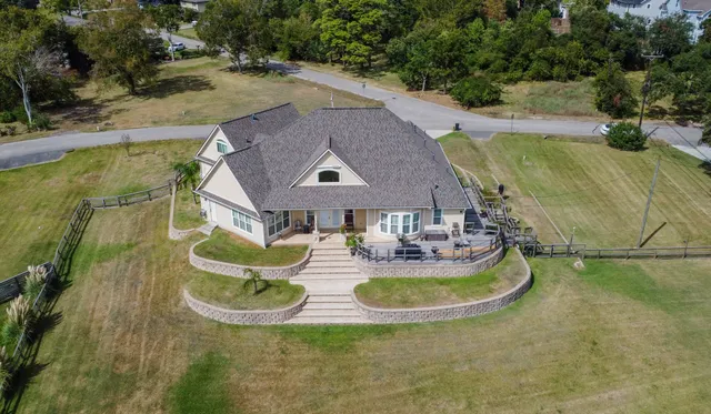 an aerial view of a house with outdoor space
