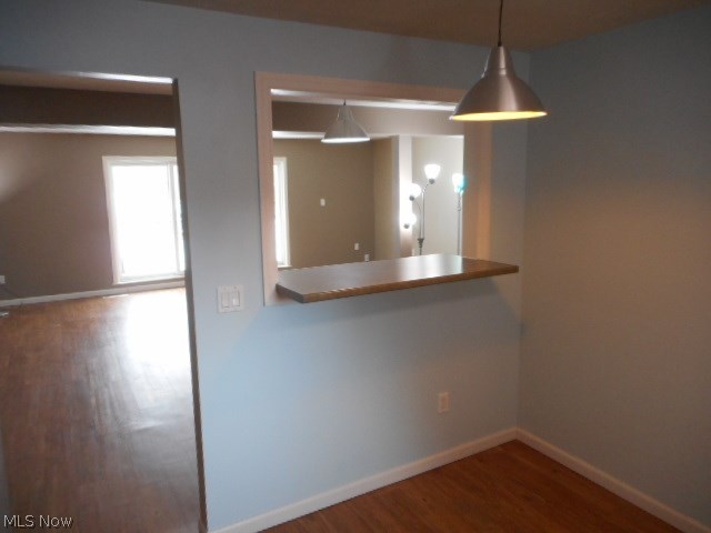 6474 State Road, Unit 6 Parma, OH 44134 - Photo 7 of 18 The seller opened up this wall to create a more open atmosphere. The vinyl-plank flooring is easy to clean and maintain, plus it is waterproof.