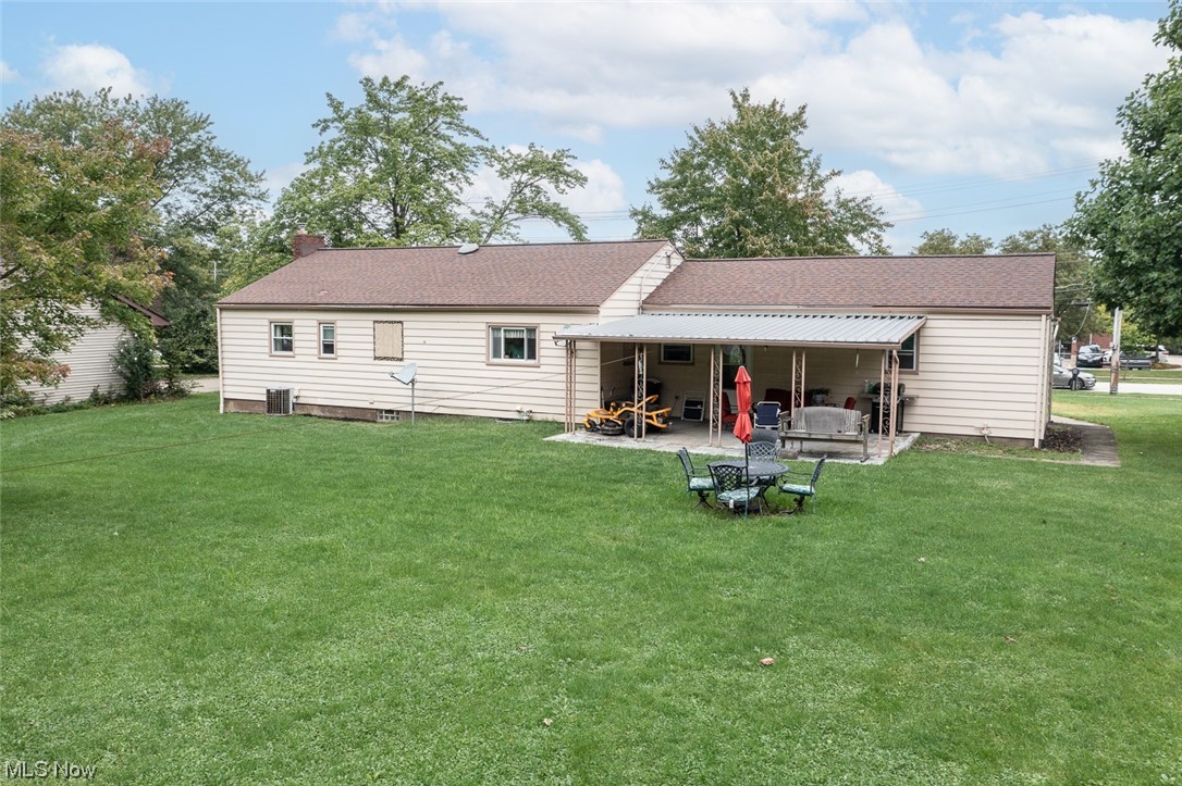20873 Drake Road Strongsville, OH 44149 - Photo 4 of 25 Back of property featuring a yard and a patio