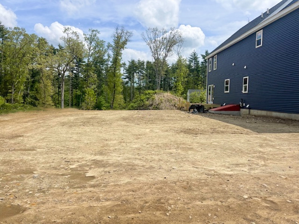 Lot 1 Valley Road Lunenburg, MA 01462 - Photo 10 of 12 a view of swimming pool with a yard and trees