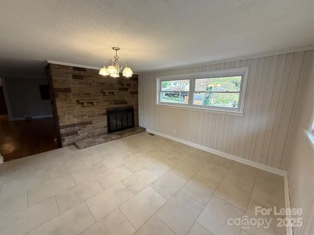 a kitchen with a sink and large window