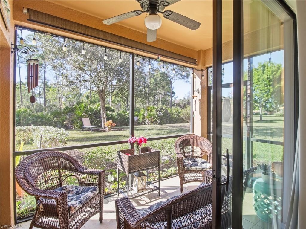 20161 Bravada Street, Unit 2 Estero, FL 33928 - Photo 22 of 33 a view of a porch with furniture and a backyard