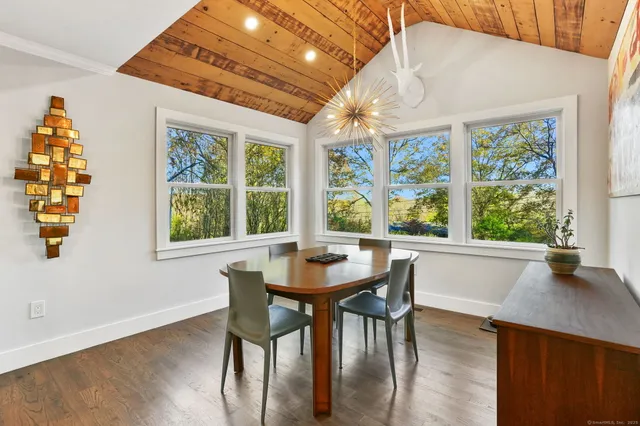 a dining room with furniture window wooden floor
