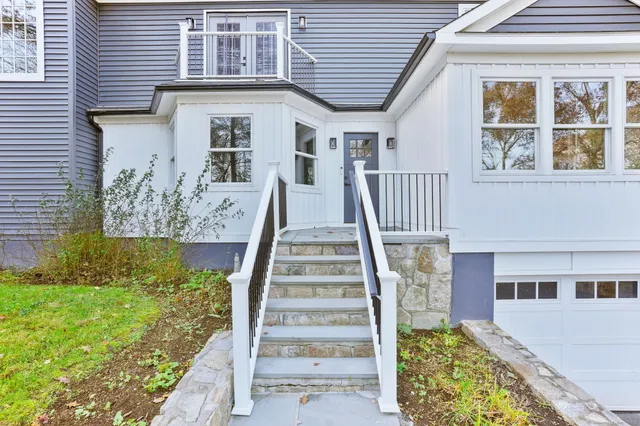 front view of a house with a yard