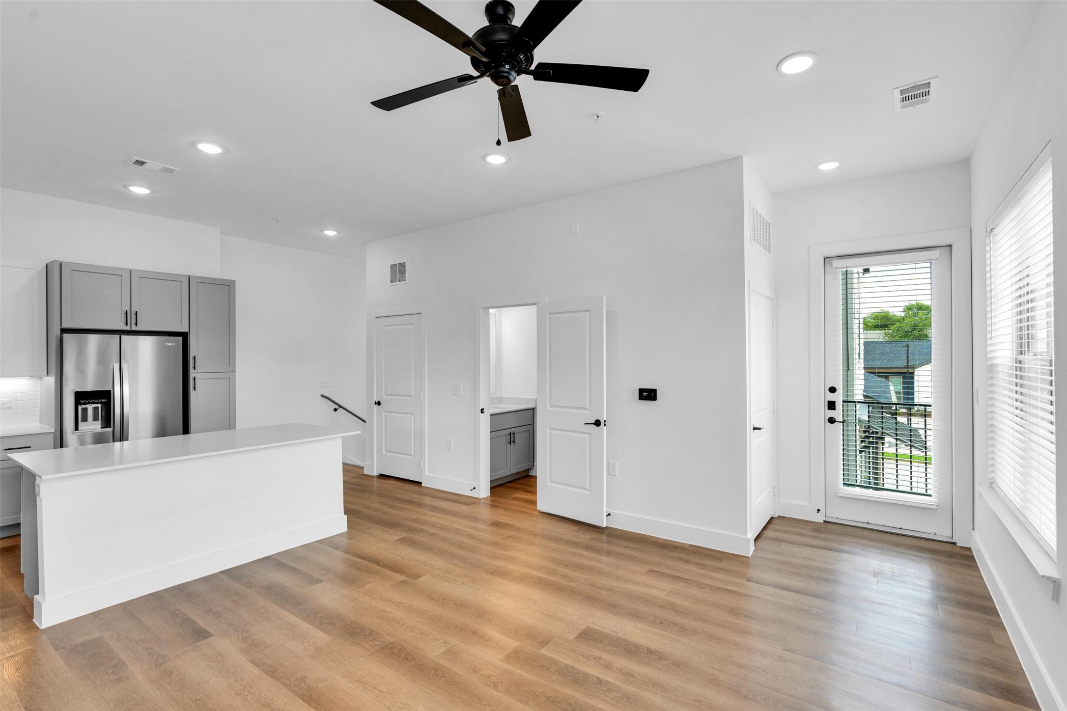 1688-343 Bernard Street Rowlett, TX 75089 - Photo 4 of 28 a view of a kitchen with a refrigerator and a window