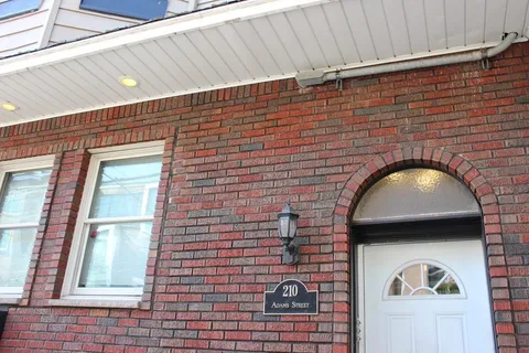 a view of a brick house with a door