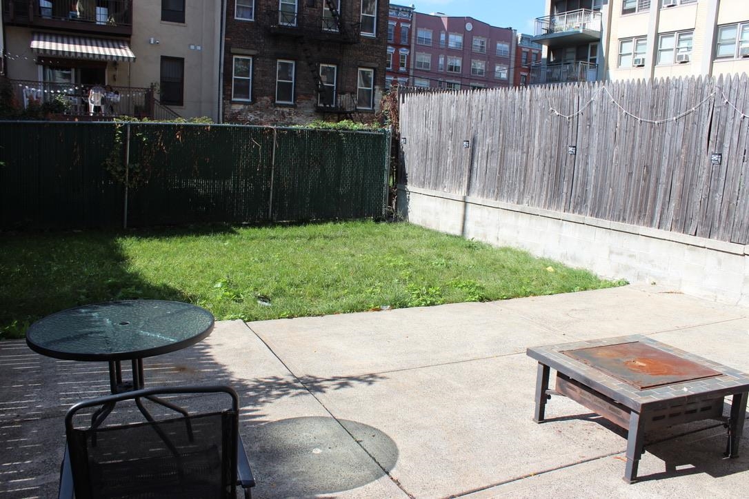 210 Adams Street, Unit 2 Hoboken, NJ 07030 - Photo 10 of 11 a bench sitting in front of a building