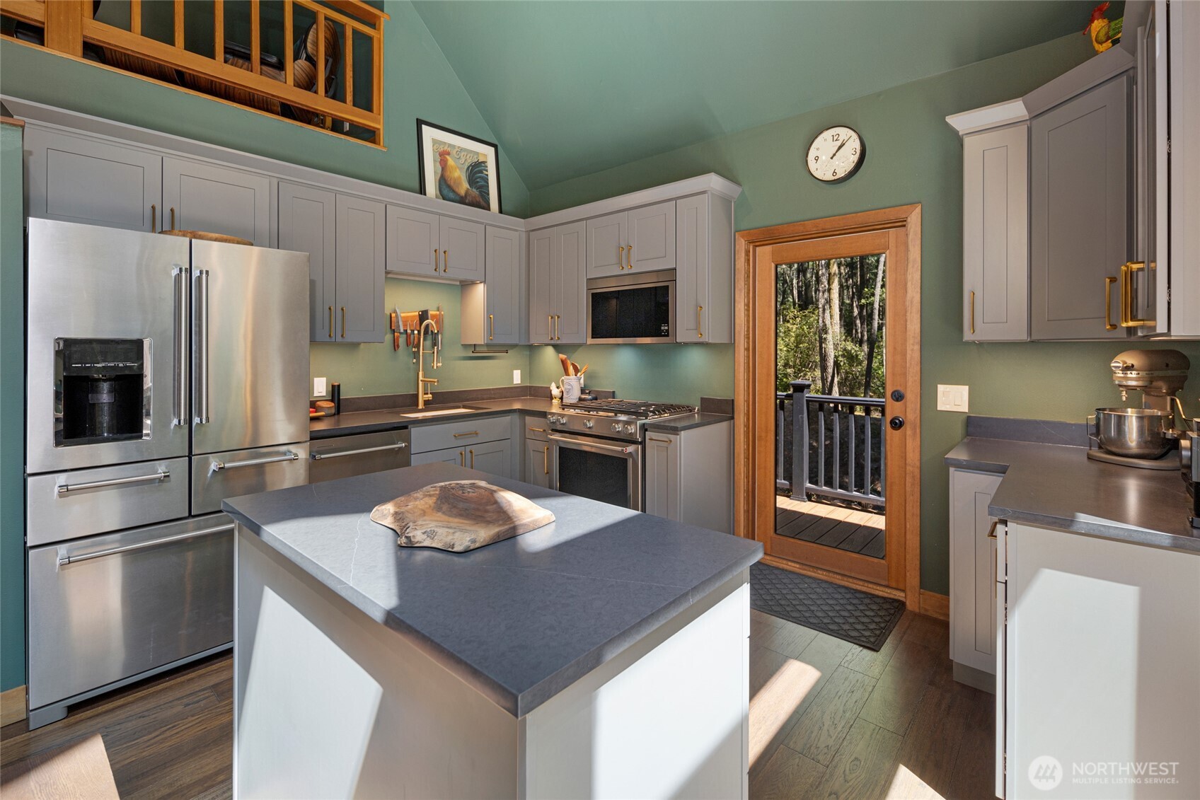 65 Sutherland Road Friday Harbor, WA 98250 - Photo 7 of 39 a kitchen with granite countertop a refrigerator stove and sink