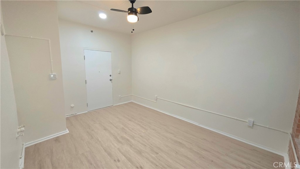 3408 Sunset Boulevard, Unit 107 Silver Lake, CA 90026 - Photo 8 of 12 an empty room with a empty space and a ceiling fan