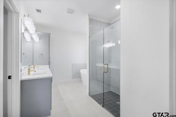 a walk in closet with empty racks