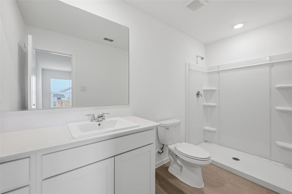 3707 Spring Run Drive Sherman, TX 75092 - Photo 12 of 18 a bathroom with a sink a toilet and shower