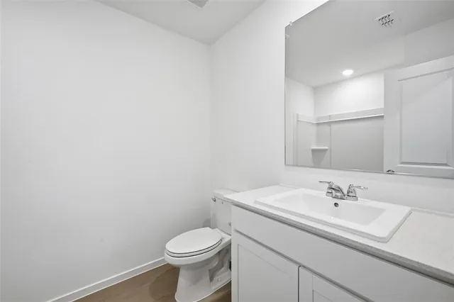 a bathroom with a tub sink shower and a mirror