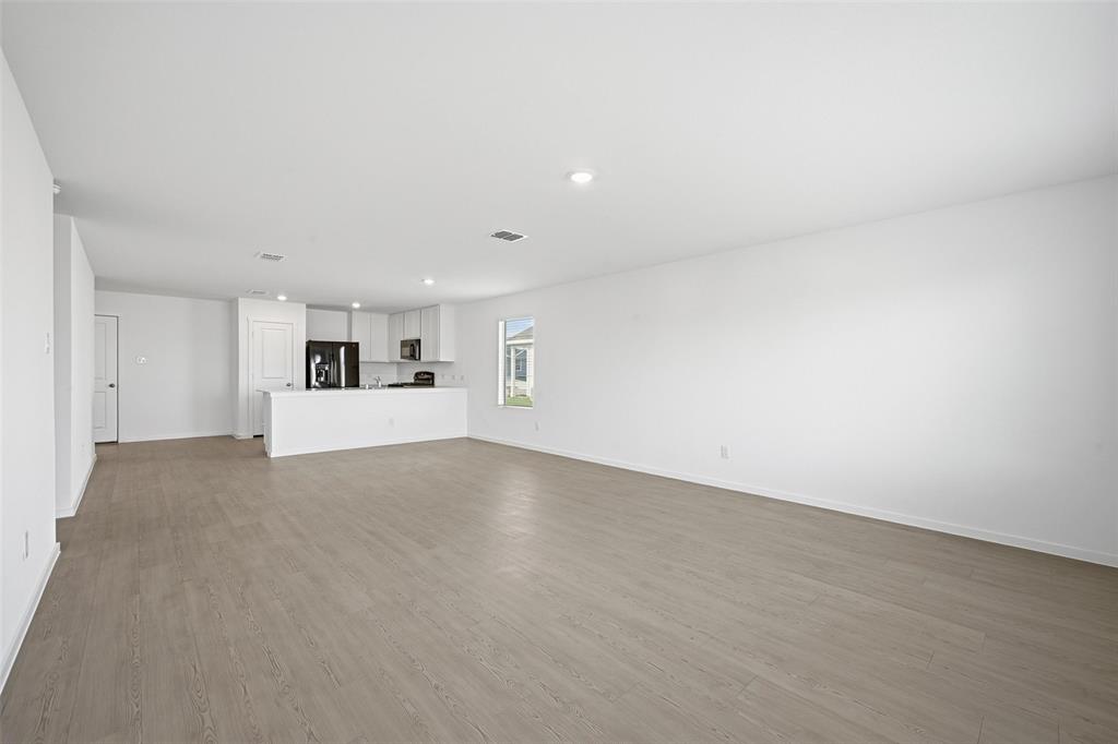 3707 Spring Run Drive Sherman, TX 75092 - Photo 3 of 18 a view of empty room with wooden floor