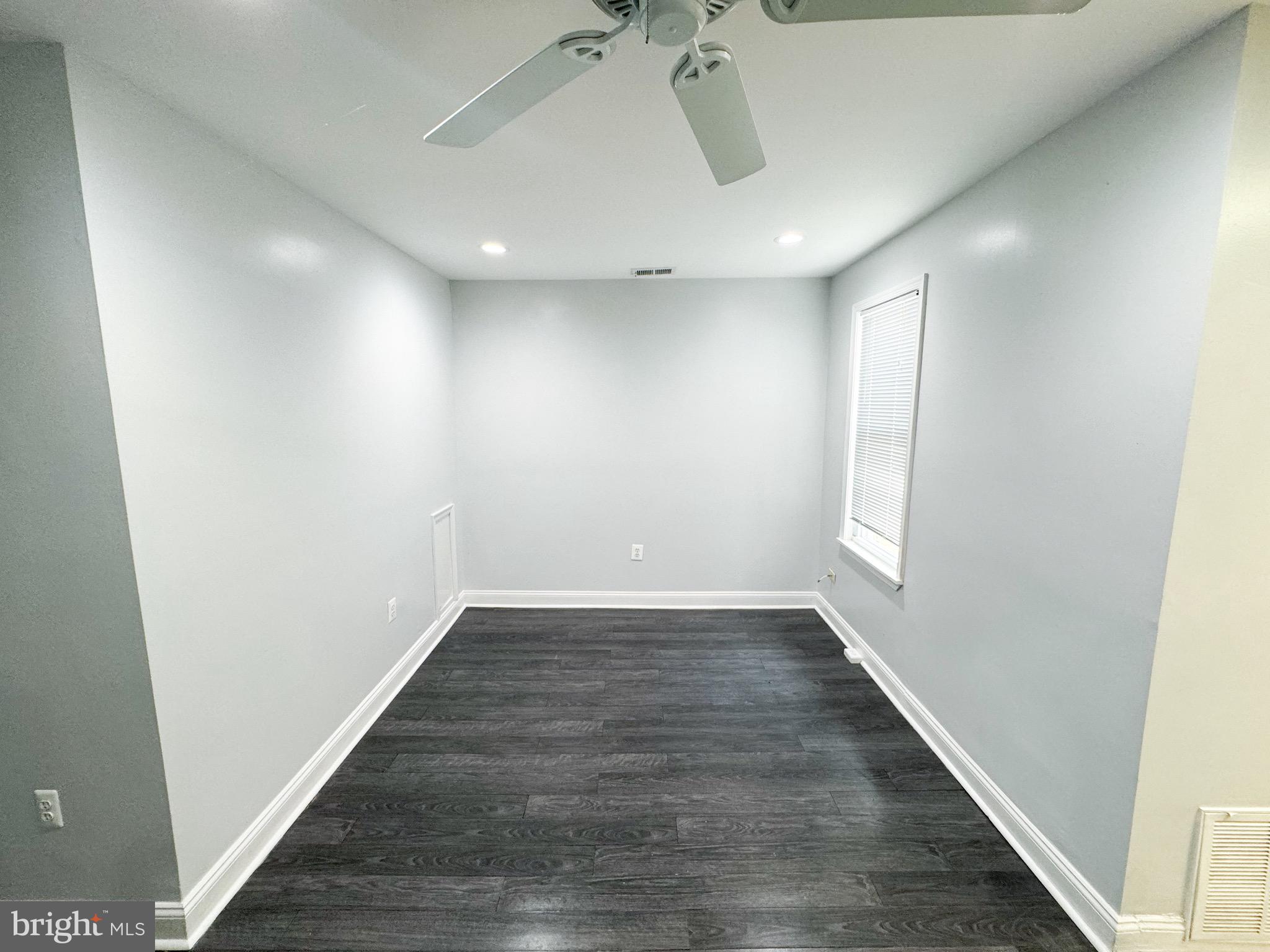 719 Euclid Street Northwest, Unit 4 Washington, DC 20001 - Photo 3 of 9 wooden floor in a hall with a window