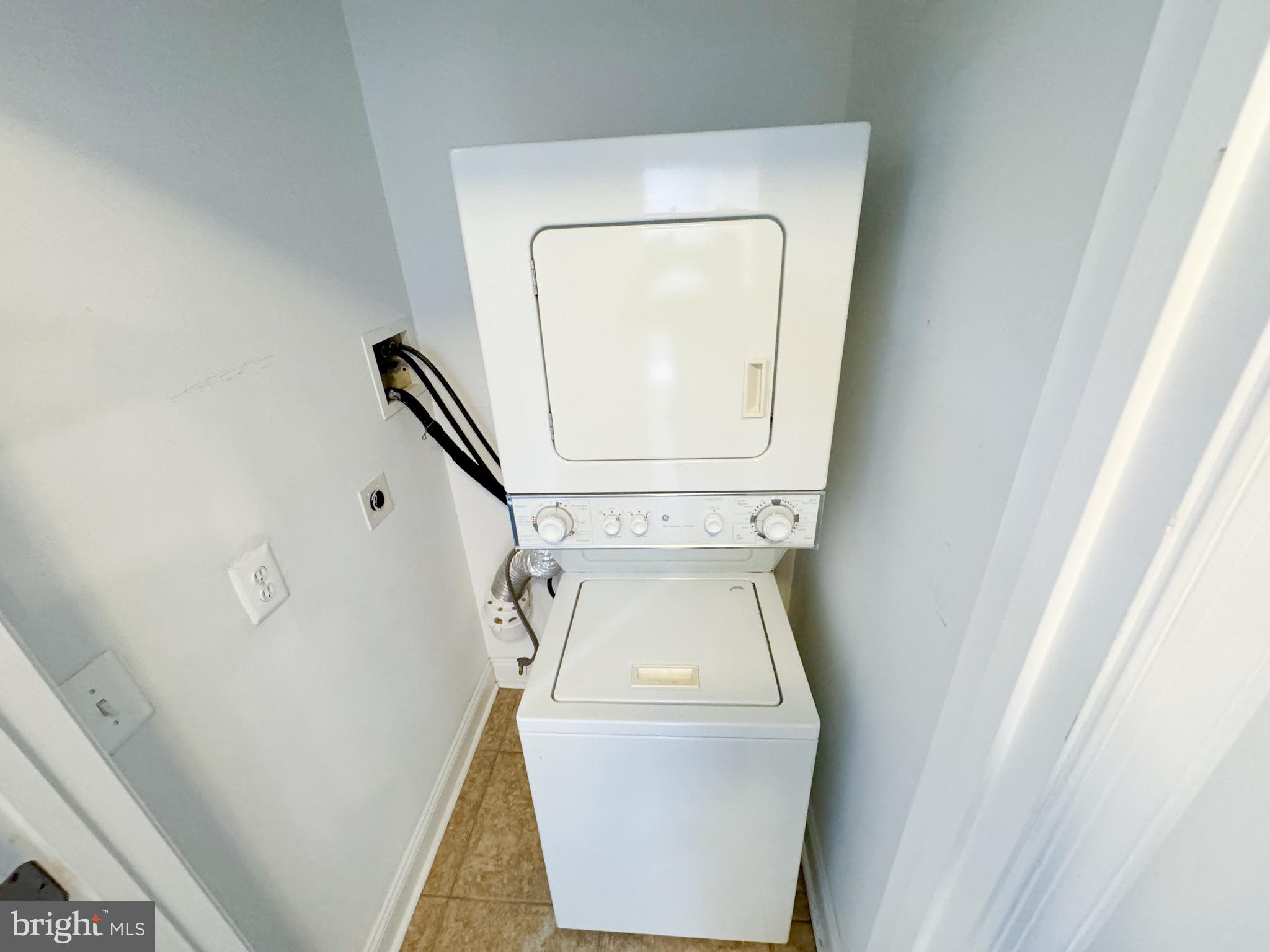 719 Euclid Street Northwest, Unit 4 Washington, DC 20001 - Photo 7 of 9 a utility room with dryer and washer