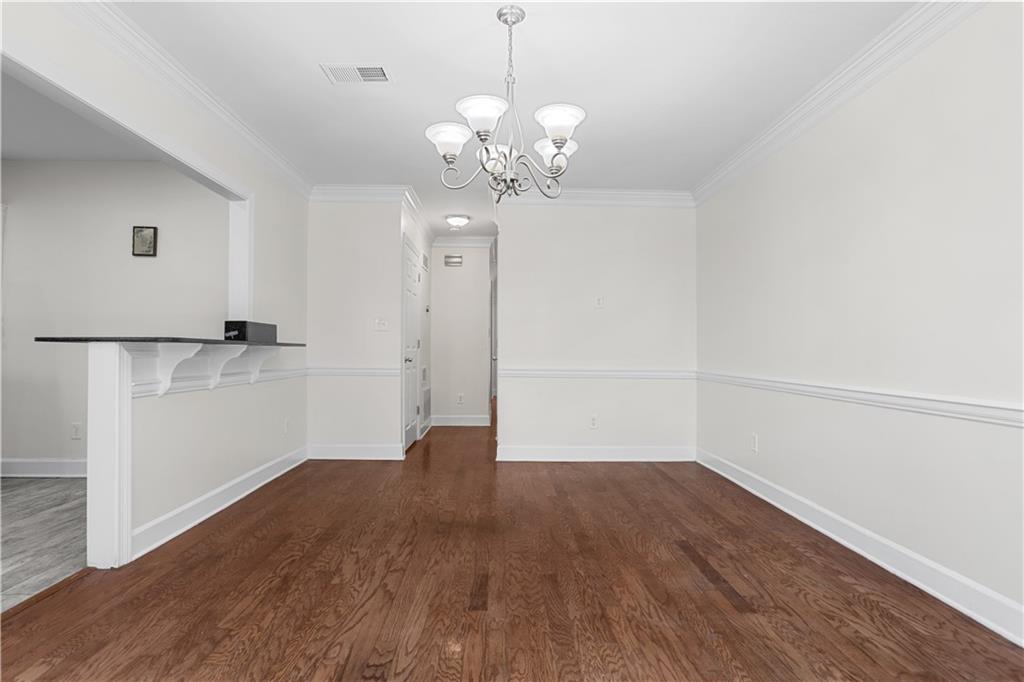 7500 Roswell Road, Unit 78 Atlanta, GA 30350 - Photo 16 of 22 a view of a hallway with wooden floor