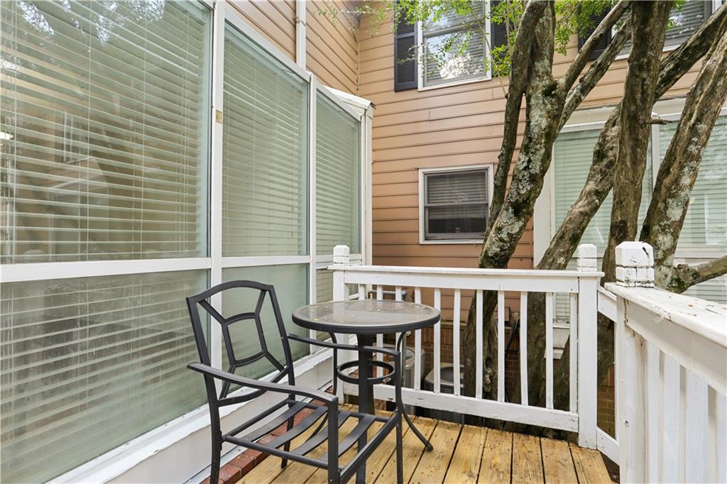 7500 Roswell Road, Unit 78 Atlanta, GA 30350 - Photo 20 of 22 a view of a chair and table in the balcony