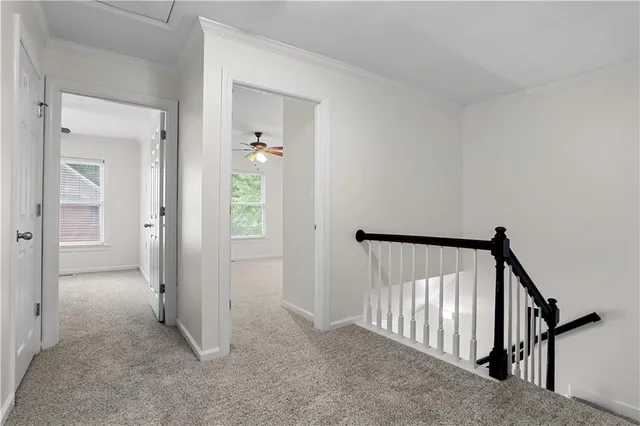 a view of a kitchen with wooden floor and a large window