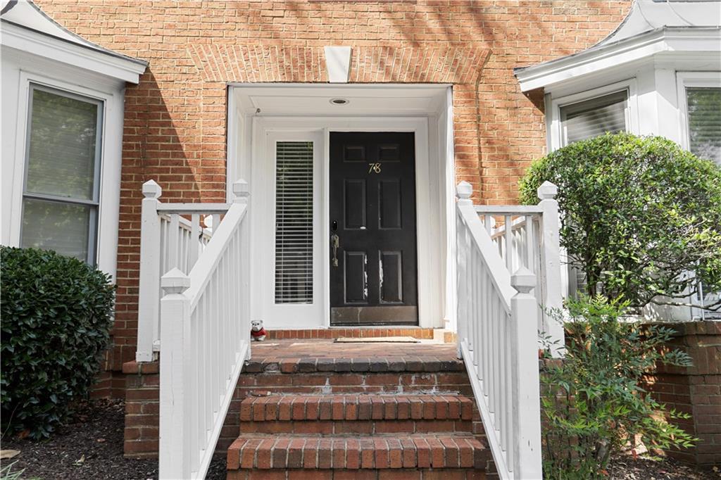 7500 Roswell Road, Unit 78 Atlanta, GA 30350 - Photo 2 of 22 front view of a house with a white door