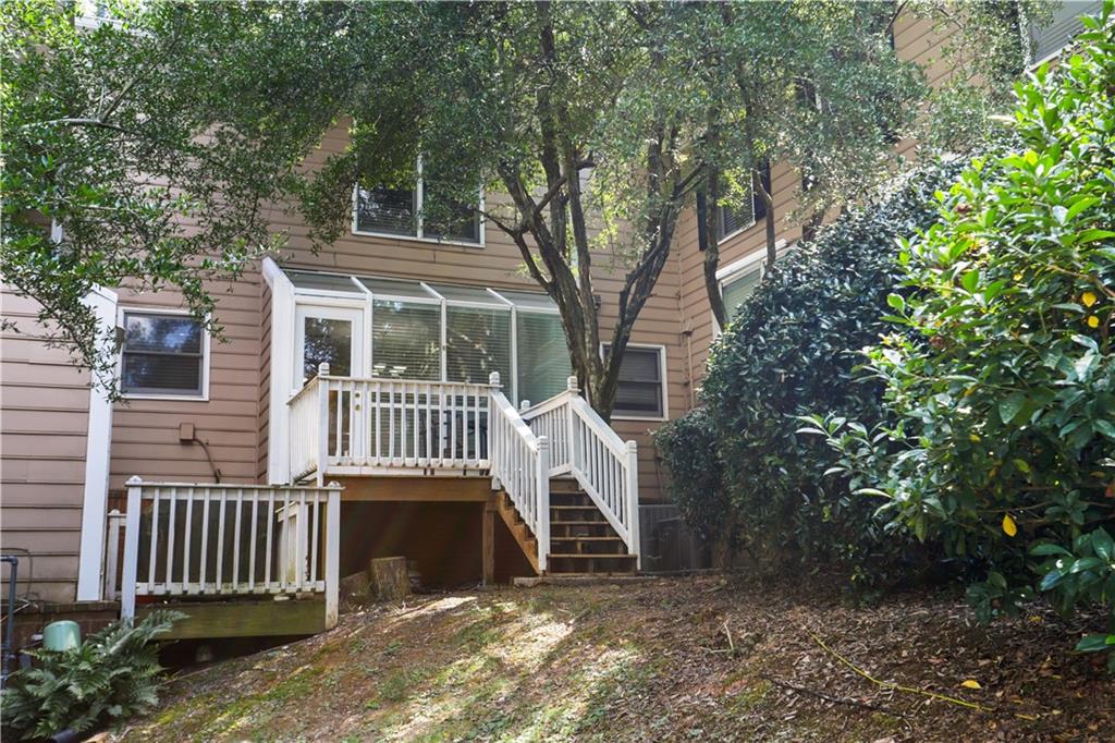 7500 Roswell Road, Unit 78 Atlanta, GA 30350 - Photo 21 of 22 a front view of a house with a yard