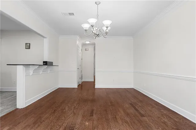 a kitchen with stainless steel appliances granite countertop a refrigerator sink and stove