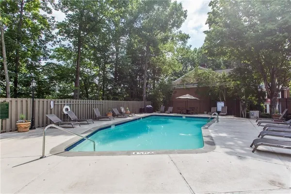 a view of a backyard with sitting area