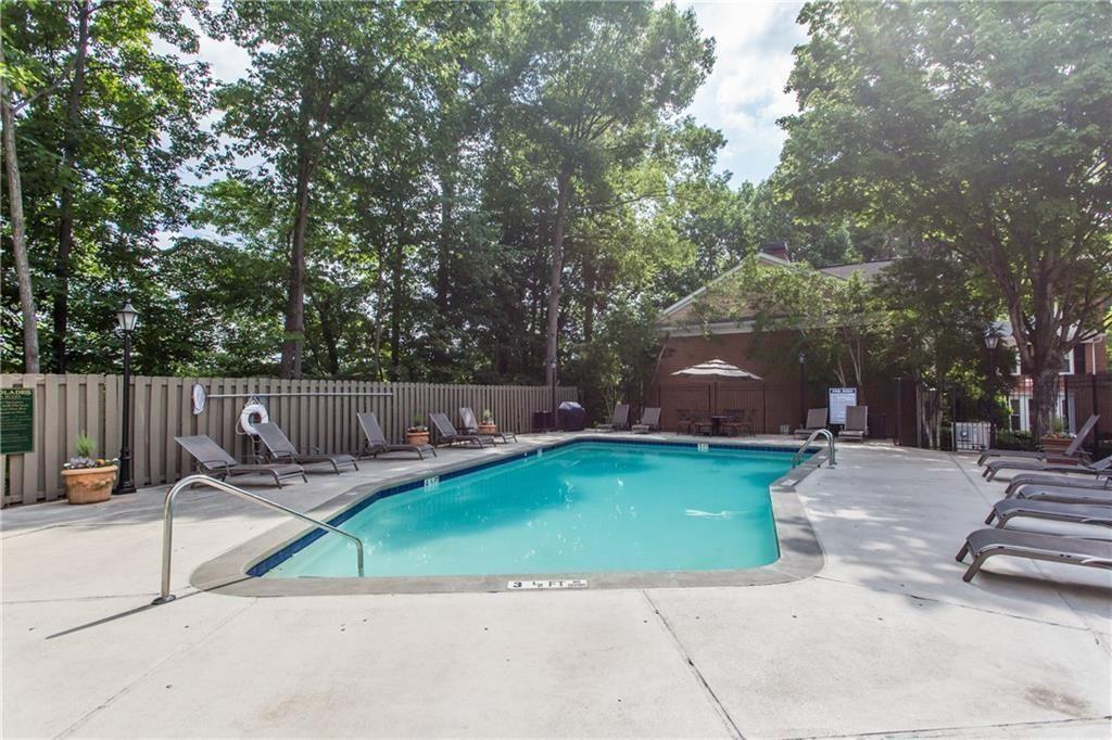 7500 Roswell Road, Unit 78 Atlanta, GA 30350 - Photo 5 of 22 a view of a backyard with sitting area
