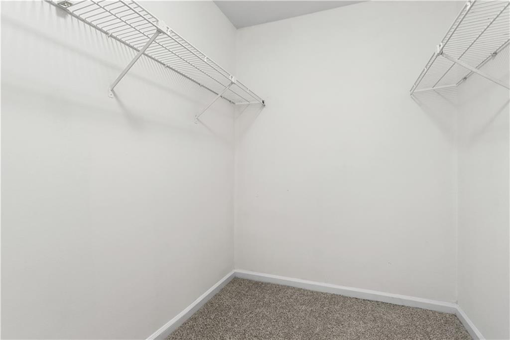 7500 Roswell Road, Unit 78 Atlanta, GA 30350 - Photo 10 of 22 a view of a room with racks on the wall