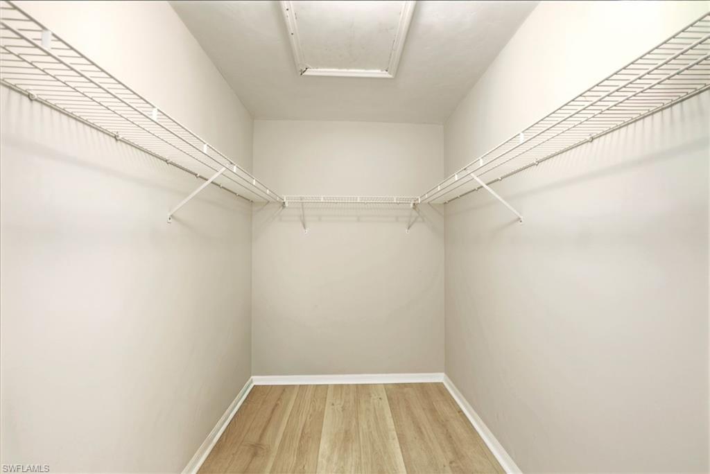 2860 Citrus Lake Drive, Unit R204 Naples, FL 34109 - Photo 21 of 38 Master Walk-in Closet