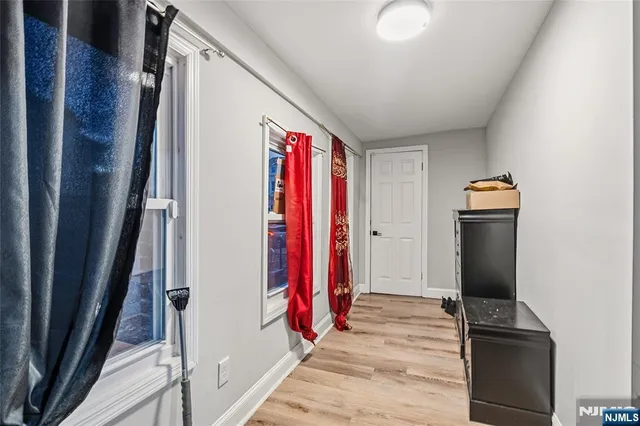 a view of front door and wooden floor