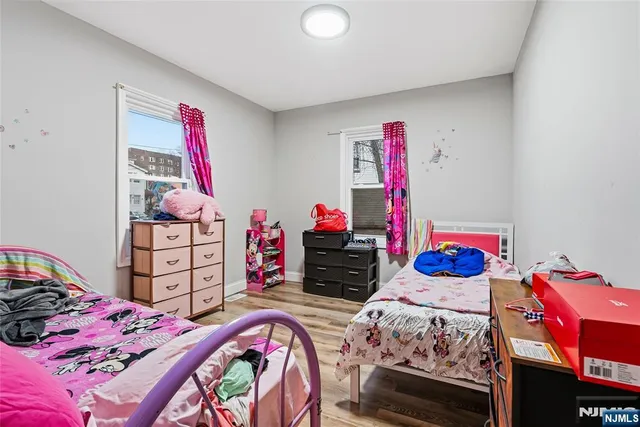 a bedroom with a bed and dresser