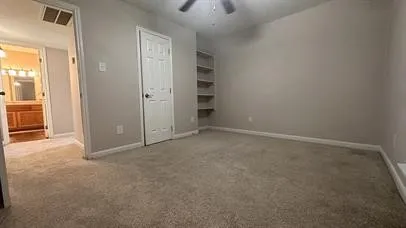 an empty room with closet area