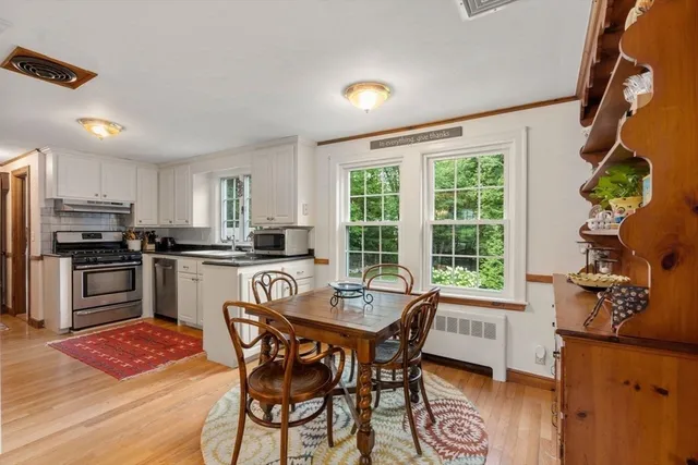 a view of a dining room with furniture window and outside view