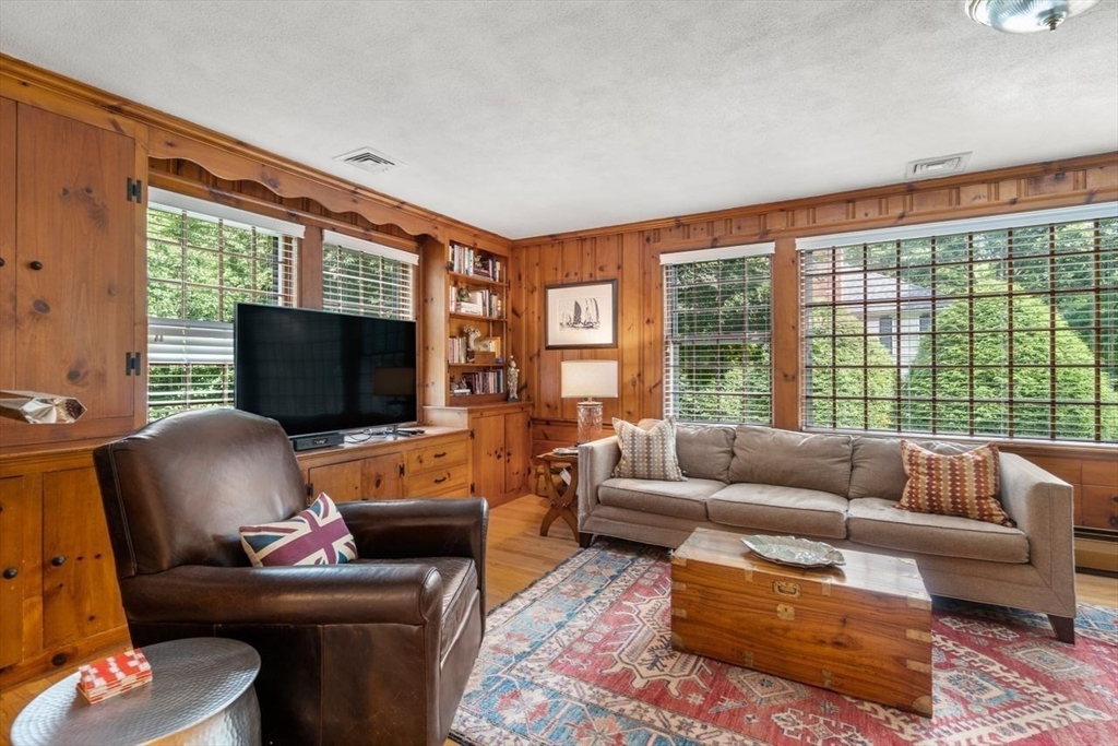 11 Nantucket Road Wellesley, MA 02481 - Photo 13 of 23 a living room with furniture a flat screen tv and a large window