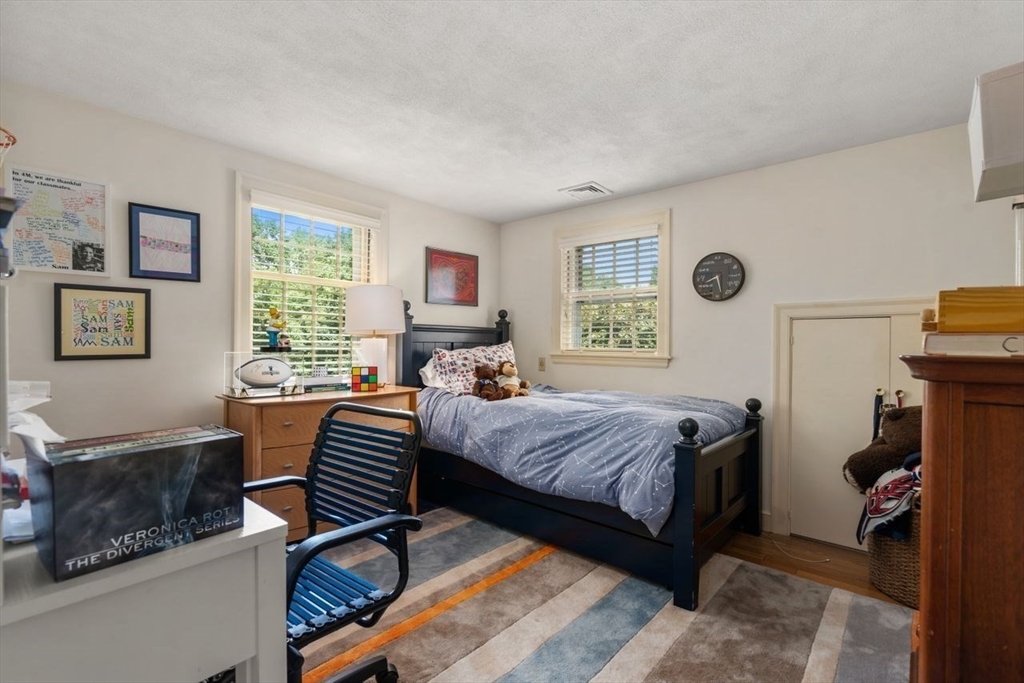 11 Nantucket Road Wellesley, MA 02481 - Photo 15 of 23 a bedroom with a bed and a couch