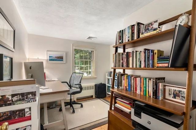 a view of a workspace with furniture
