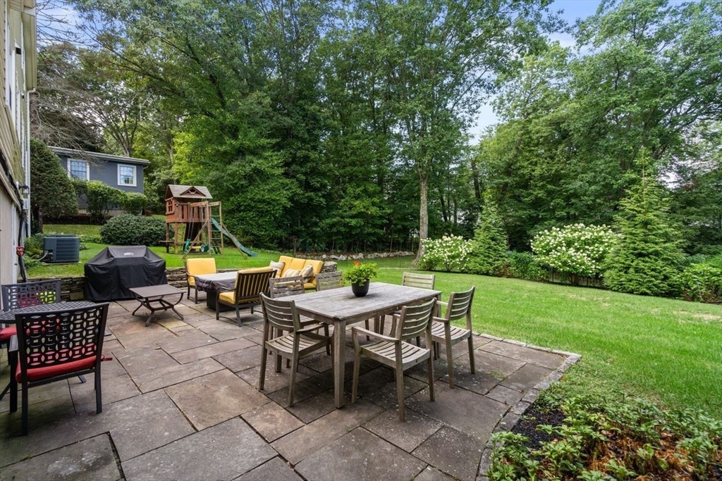 11 Nantucket Road Wellesley, MA 02481 - Photo 4 of 23 a backyard of a house with outdoor seating