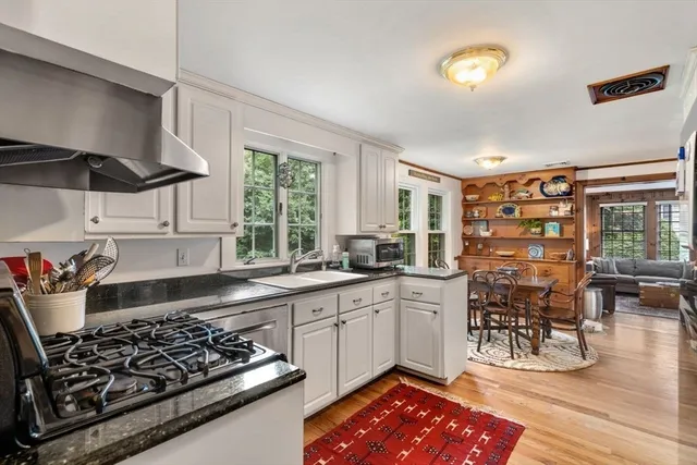 a kitchen with a stove a sink and a refrigerator